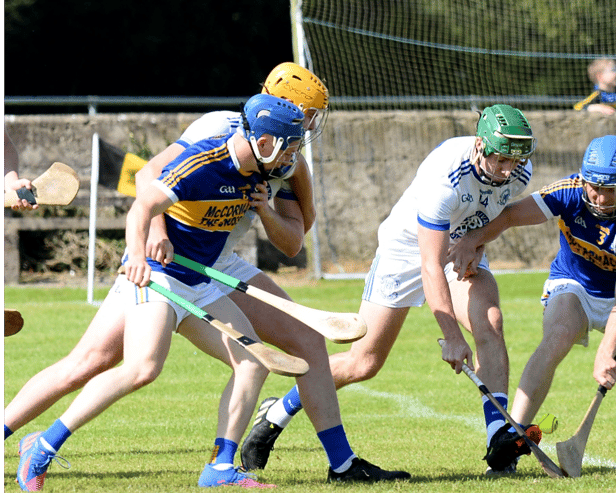 Sean Hickey, Sean Treacys (right) and Niall Hoctor of St Mary's in a scrap for possession. Picture: Michael Boland