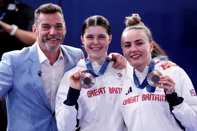 Chinese pair Chen Yuxi and Quan Hongchan successfully defended their Olympic gold, while North Korea pair Jo Jin Mi and Kim Mirae earned silver.