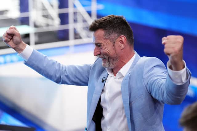 The 52-year-old First Dates star cheered with both hands in the air as Spendolini-Sirieix and Toulson secured third place at the Aquatics Centre.