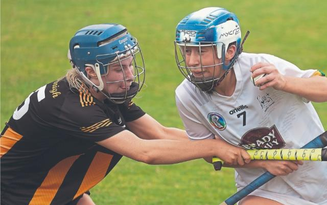 Kildare wingback Ellen Morgan pushes her way past Kilkenny Ciara Foskin during the Glen Dimplex All-Ireland Camogie Intermediate Championship.  Photo: Sean Brilly
