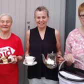 Judith Hinchliff in the Christian Aid t-shirt stands alongside fellow coffee morning organisers Irene Hurst (left), Elizabeth Kennedy (middle) and Myra Doherty (right)