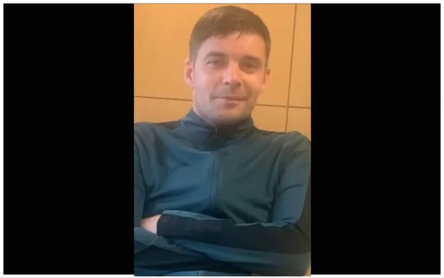 When last seen, Jonathan was wearing a green tracksuit with a black trim on the side.