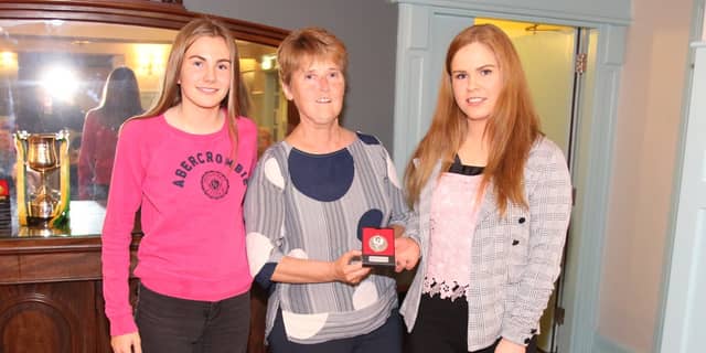 Patricia Harkin with Illies Celtic players Emma Doherty and Alison McGonigle in 2019