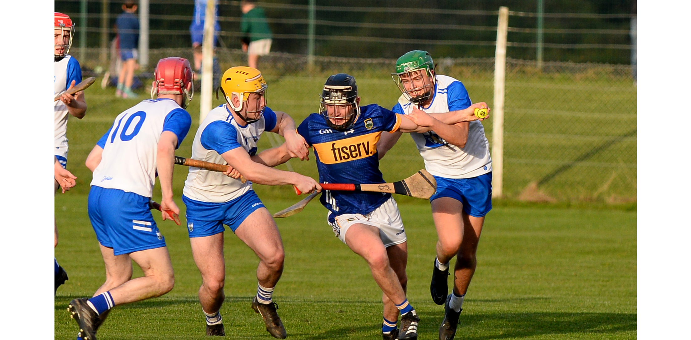 Tipperary's Eoin Craddock battles his way through the challenges of Waterford's Cillian Ryan and Scott Fleming. Picture: Michael Boland