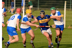 Tipperary's Eoin Craddock battles his way through the challenges of Waterford's Cillian Ryan and Scott Fleming. Picture: Michael Boland