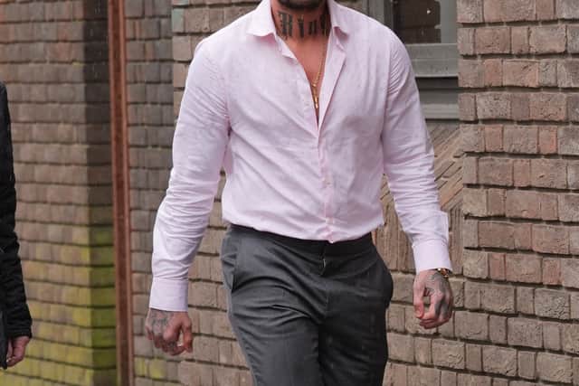 He gave a thumbs up to reporters as he arrived at court on Friday, in sunglasses, a pink shirt and a pair of slippers.