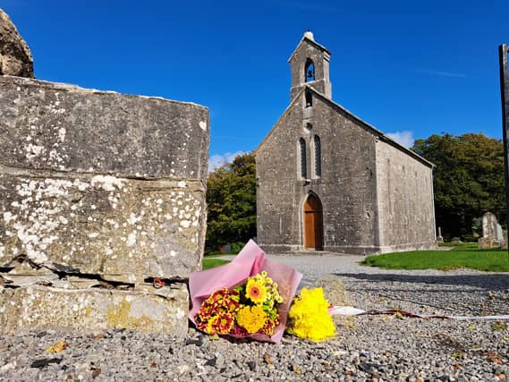 Flowers laid at the foot of Rock of Dunamase where US tourist died after being knocked down .