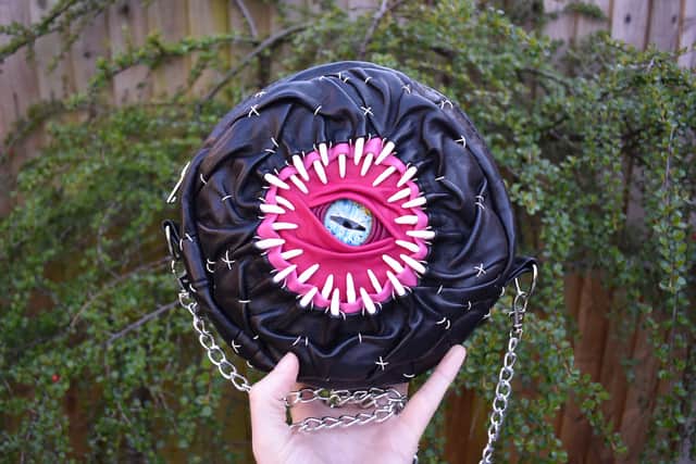 She also offers £200 dice bags for fellow role-playing gamers, as well as tote bags and cross body bags, decorated with an eye surrounded by teeth and hand stitched with heavy gauge French linen thread, which sell for around £1,000.