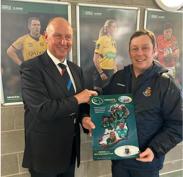 Bertie Smith presenting the frame to Rockwell College gamesmaster John Ryan