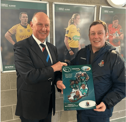 Bertie Smith presenting the frame to Rockwell College gamesmaster John Ryan