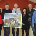 Members of the BOM of Carrig NS pictured making a presentation to retiring Principal Mr Tony Sampson before the Christmas break.