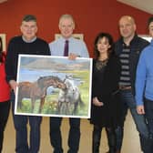 Members of the BOM of Carrig NS pictured making a presentation to retiring Principal Mr Tony Sampson before the Christmas break.