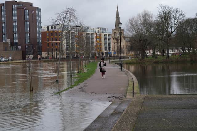 In east London, around 50 people were led to safety by firefighters overnight after a canal burst its banks in Hackney Wick, causing flooding in an area of around 10 acres.