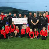 Members of Moneygall FC accept the cheque for €10,000  as part of Circle K’s €100,000 giveaway to grassroots football clubs in the Republic of Ireland