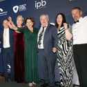 Carndonagh Traders Association accept their award from Trevor Ringland, Co-operation Ireland, and John Hogan, Chairman, IPB Insurance