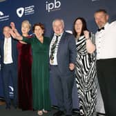 Carndonagh Traders Association accept their award from Trevor Ringland, Co-operation Ireland, and John Hogan, Chairman, IPB Insurance