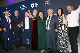 Carndonagh Traders Association accept their award from Trevor Ringland, Co-operation Ireland, and John Hogan, Chairman, IPB Insurance