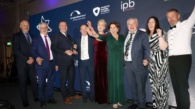Carndonagh Traders Association accept their award from Trevor Ringland, Co-operation Ireland, and John Hogan, Chairman, IPB Insurance