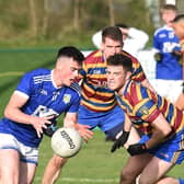 Roche Emmet's Liam Dawe confronted by Shane Costello. Photo: Arthur Kinahan