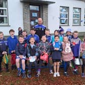 Naomh Conaill's John O'Malley with the Scoil Mhuire second class pupils in Glenties before their trip to Letterkenny