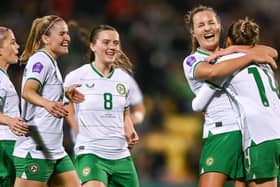 Erin McLaughlin and Tyler Toland celebrate with goalscorer Kyra Carusa. Photo: Sportsfile