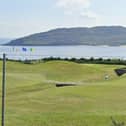 Portsalon Golf Club with Portsalon Beach behind.