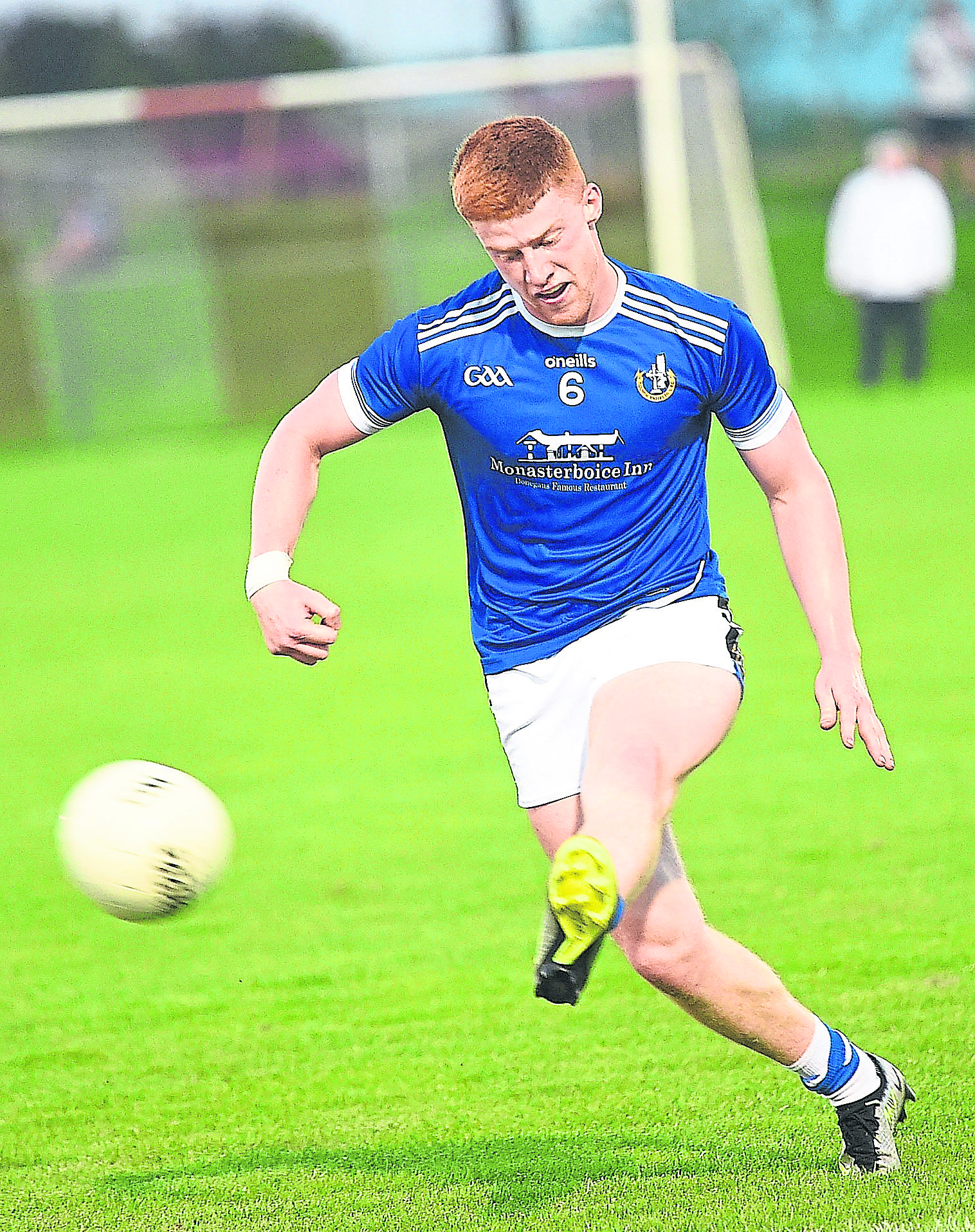 Sean Healy  sending Naomh Mairtin attacking. ALL PHOTOS: ARTHUR KINAHAN