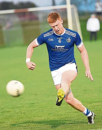 Sean Healy sending Naomh Mairtin attacking. ALL PHOTOS: ARTHUR KINAHAN