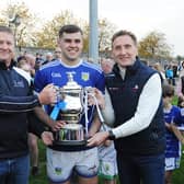 Glen Stewart, Captain of Roche Emmets,  receiving the Cti Business Solutions  IFC  cup from Billy Lawlor of the Sponsors Cti & Peter Fitzpatrick  Chairman LCB after Sunday's final. Pic: Arthur Kinahan