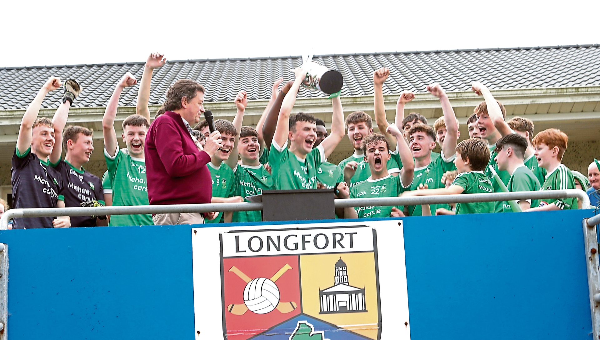 The jubilant Clonguish Og U-18 players celebrate after the captain Michael Flynn received the Harte Cup from Longford GAA Chairperson Albert Cooney  Photo: Syl Healy