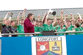 The jubilant Clonguish Og U-18 players celebrate after the captain Michael Flynn received the Harte Cup from Longford GAA Chairperson Albert Cooney  Photo: Syl Healy