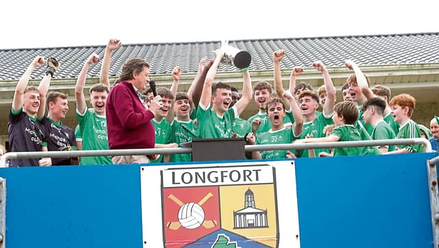 The jubilant Clonguish Og U-18 players celebrate after the captain Michael Flynn received the Harte Cup from Longford GAA Chairperson Albert Cooney Photo: Syl Healy