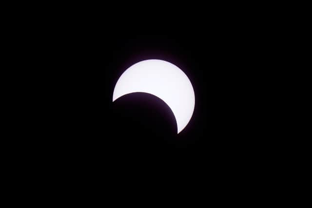 Members of a crowd at the Eugene Science Centre in Eugene, Oregon, were desperately wishing for the clouds on the horizon to clear. Dozens of people set up telescopes and cameras with special filters in the hopes of capturing the celestial event.