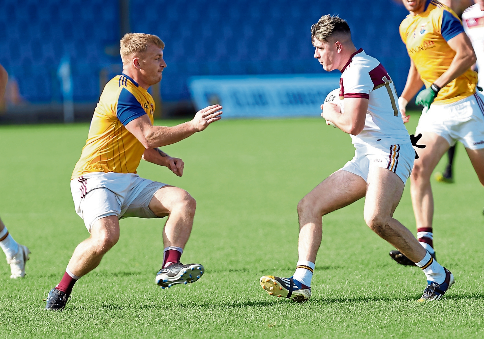 Cian Cassidy on the attack for Fr Manning Gaels in facing the challenge of Kenagh defender Lee Ross Gill. Action from the IFC semi-final on Sunday Photo: Syl Healy