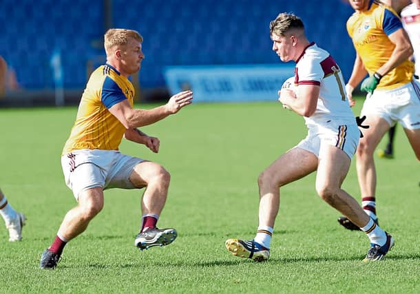 Cian Cassidy on the attack for Fr Manning Gaels in facing the challenge of Kenagh defender Lee Ross Gill. Action from the IFC semi-final on Sunday Photo: Syl Healy
