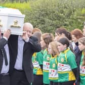 The remains of young Ronan Wilson is carried in St Mary's Church at Dunnamore by family members as it passes a guard of honour by members of the local GAA club.  (NW Newspix)