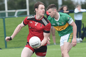 Seanie Crosby St Kevins gettig away from O'Mahonys Rob Galligan at the game in Darver. Photo: Arthur Kinahan