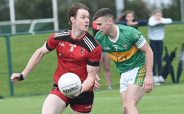 Seanie Crosby St Kevins gettig away from O'Mahonys Rob Galligan at the game in Darver. Photo: Arthur Kinahan