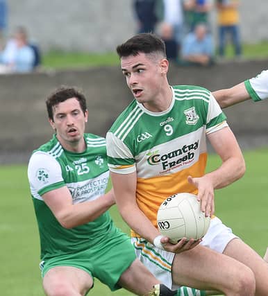 St Pat's Eoghan Lafferty keeping tabs on St Joseph's Conal McCaul. Pics Arthur Kinahan