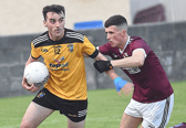 Brendan O'Hagan Cuchulain Gaels gets the better of Oliver Plunketts  Cillian Smith in the Louth Junior Championship final game in Clan Na Gael Park. Photo: Arthur Kinahan