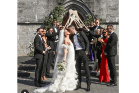 You may kiss the bride! Limerick hurling captain and his wife Louise Cantillon share a kiss outside Holy Trinity Abbey Church in Adare    PIC| Louise Cantillon Instagram