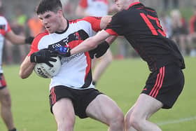Brian Callaghan, St Kevins getting the better of Mattock's Eoin McCluskey  in the IFC game in Darver. Pic Arthur Kinahan
