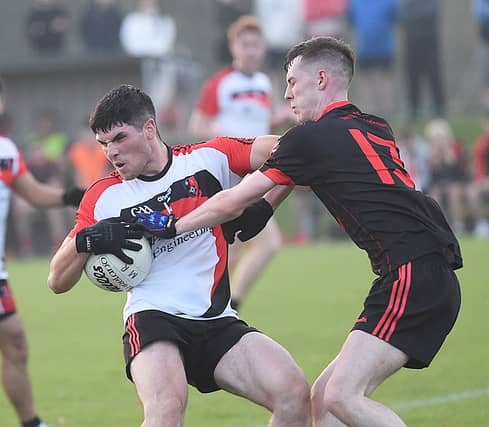 Brian Callaghan, St Kevins getting the better of Mattock's Eoin McCluskey in the IFC game in Darver. Pic Arthur Kinahan