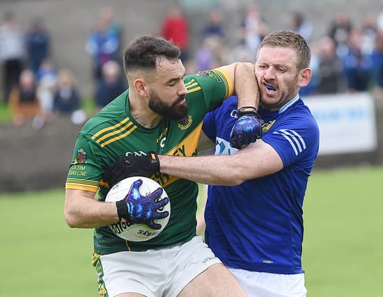 Tough midfield battle between Peter Thornton of Cooley and St Mary's Robert Leavy. Pics: Arthur Kinahan