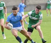 Conor Branigan Newtown Blues gets awat from St Patrick's Barry Dunne. Pic: Arthur Kinahan