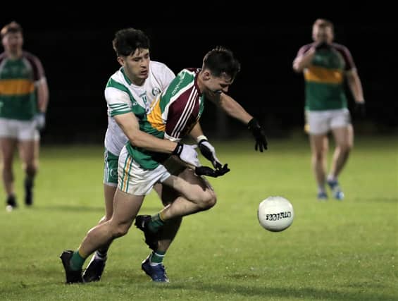 Ardagh Moydow defender Diarmuid Farrell and Killashee attacker Dylan Farell in a battle for the ball. Action the IFC Round 6 clash at McGann Park on Friday night last Photo: Syl Healy