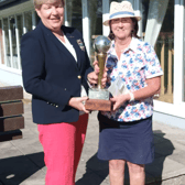 Pauline Lucey being presented with the Carrigan Cup by Lady Captain Ann O’Dea after her recent win at Slievenamon Golf Club