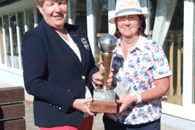 Pauline Lucey being presented with the Carrigan Cup by Lady Captain Ann O’Dea after her recent win at Slievenamon Golf Club