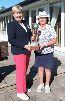 Pauline Lucey being presented with the Carrigan Cup by Lady Captain Ann O’Dea after her recent win at Slievenamon Golf Club