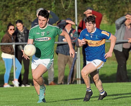 Matthew Carey on the attack for Clonguish in breaking away from Dromard defender Dylan McCormack. Action from the SFC Round 3 clash at Lynch Park Photo: Photo: Syl Healy